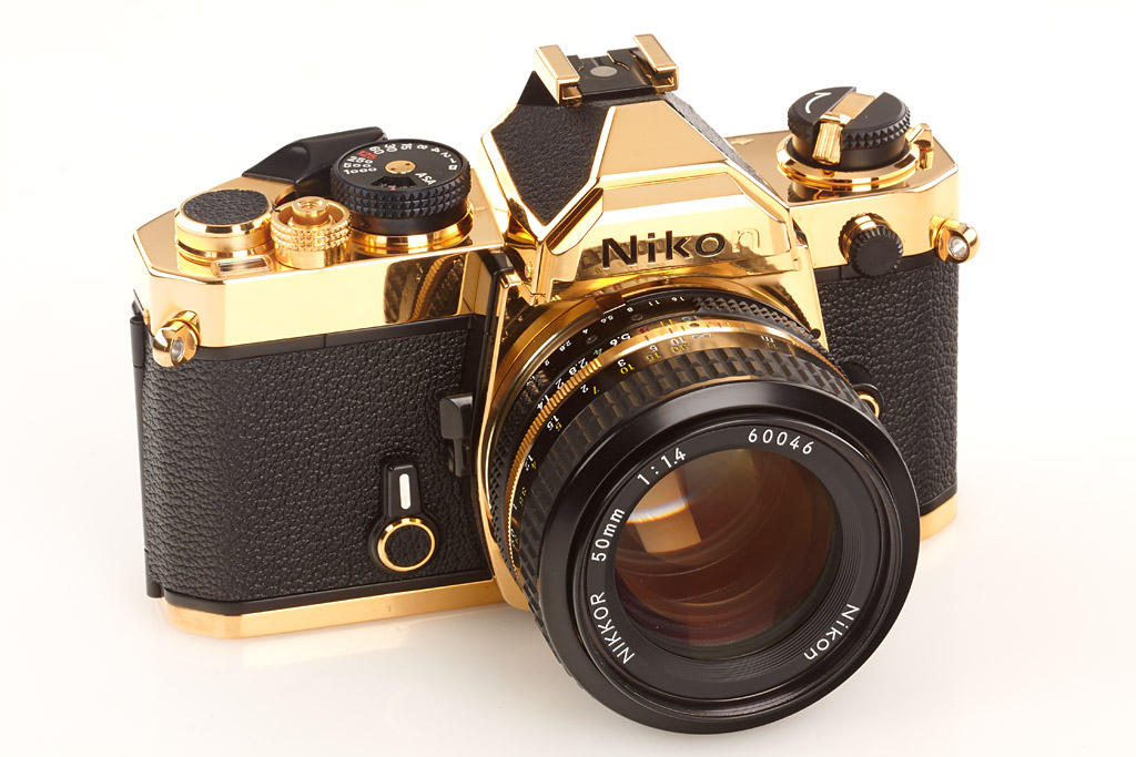 Gold-plated Nikon FM with matching lens
