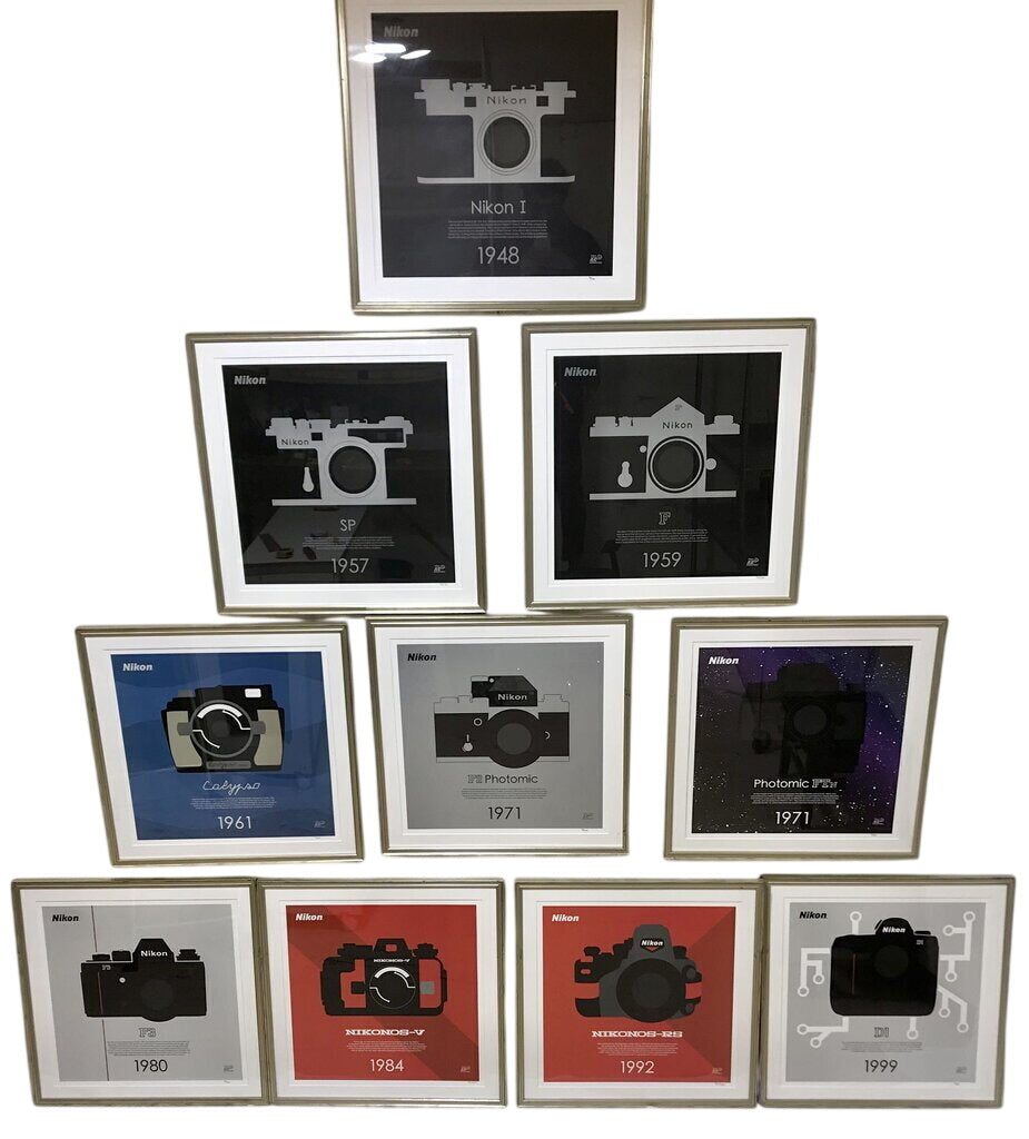 Ten framed Nikon 100th Anniversary limited-edition camera posters
